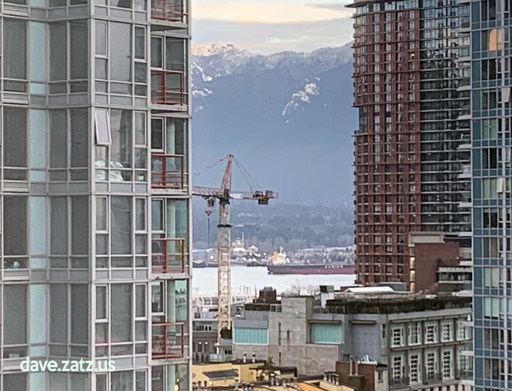 Vancouver - crane, buildings, mountains